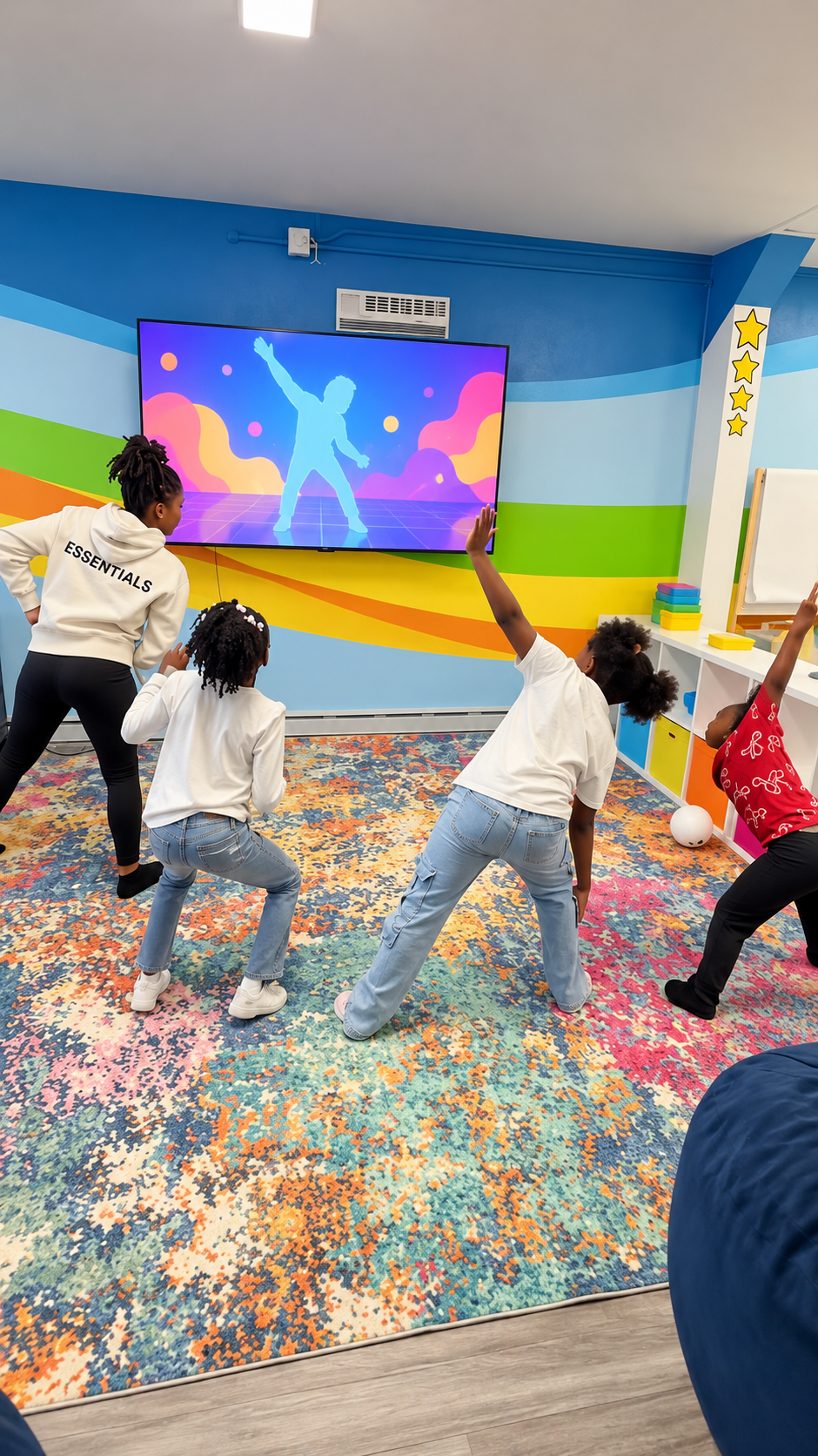 Children dancing together in the Learn & Play activity room